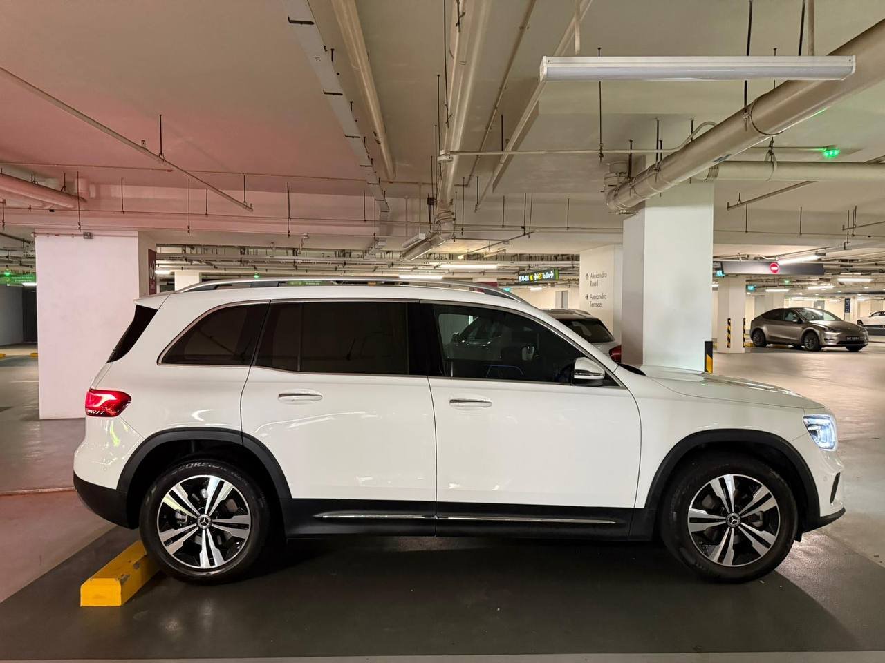 White Mercedes GLB SUV, side profile, parked in a garage